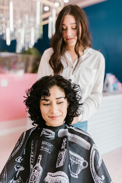 hair stylist giving a hair cut